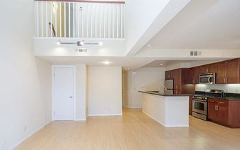 a kitchen and living room in an apartment